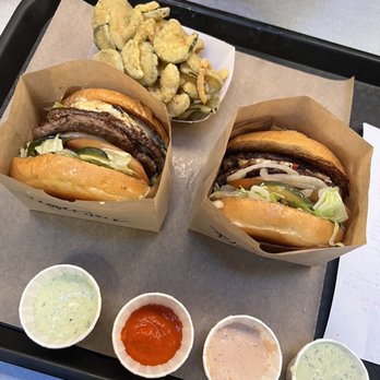 Wild Pastures Burger - Our 2 burgers with fried pickles and sauces from left to right - paleo herb ranch, truffle hot sauce (my favorite), wild sauce - Burgers Near Me - Boulder, Colorado Wild Pastures Burger - Our 2 burgers with fried pickles and sauces from left to right - paleo herb ranch, truffle hot sauce (my favorite), wild sauce - Burgers Near Me - Boulder, Colorado