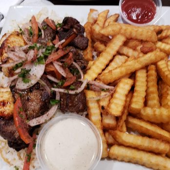 Cairo Restaurant & Cafe - Chicken and beef kabob, with lamb chops. Served over rice and a side of fries. - Hookah Bars Near Me - Anaheim, California Cairo Restaurant & Cafe - Chicken and beef kabob, with lamb chops. Served over rice and a side of fries. - Hookah Bars Near Me - Anaheim, California