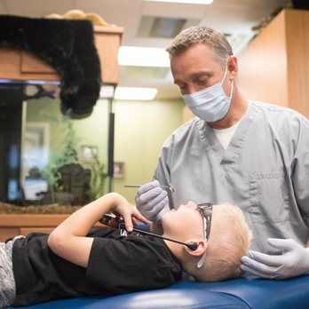 Cedar View Pediatric Dentistry - Dr Tyler working with client. - Pediatric Dentists Near Me - Cedar City, Utah Cedar View Pediatric Dentistry - Dr Tyler working with client. - Pediatric Dentists Near Me - Cedar City, Utah