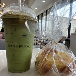 Matcha latte with a shot of espresso and milk bread.  Both items are delicious and can become very addictive.