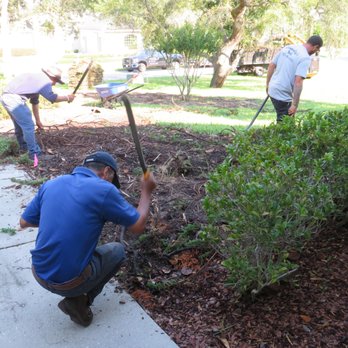 Connolly's Sod - two men working on a garden - Lawn Services Near Me - Spring, Florida Connolly's Sod - two men working on a garden - Lawn Services Near Me - Spring, Florida
