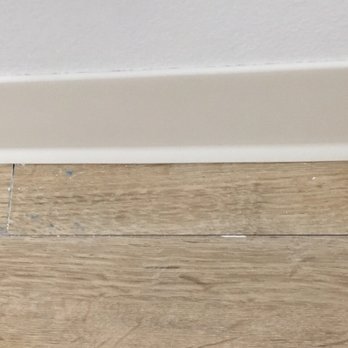Brad Man Handy - Dried paint between floor planks. And gap between floor planks that wasn't there before. - Handyman Near Me - Long Beach, California