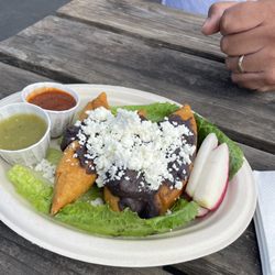Alebrijes Oaxacan Kitchen - Molete. Deep fried dough with potato and chorizo