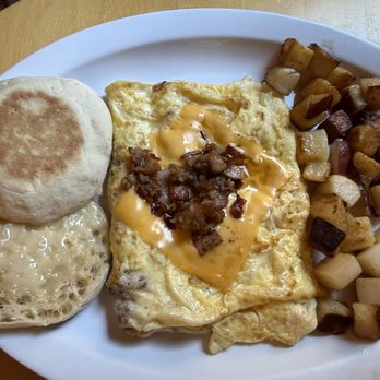 The Egg Cafe - Mixed grill omelet with fried potatoes and an English muffin - Breakfast & Brunch Near Me - Davidson, North Carolina The Egg Cafe - Mixed grill omelet with fried potatoes and an English muffin - Breakfast & Brunch Near Me - Davidson, North Carolina