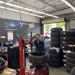 Oscar mounting the rim on tire.