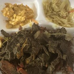 Curry goat, cabbage, and Mac. Sorry, day 2 leftover pic. Too much thick sauce.