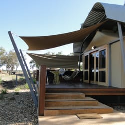 Zoofari Lodge - Verandah with tables, chairs and lounge