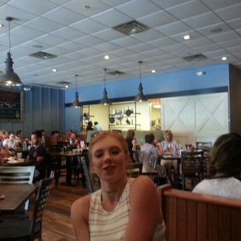 First Watch - Open view of kitchen....and my daughter that wanted to photo bomb. - Breakfast & Brunch Near Me - Fairfax, Virginia