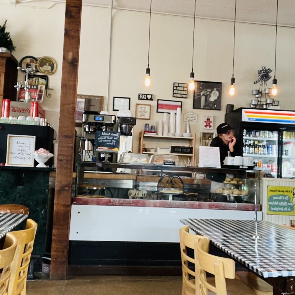 Corner Drug Cafe - a woman sitting at a table - Breakfast & Brunch Near Me - Clifton, Texas Corner Drug Cafe - a woman sitting at a table - Breakfast & Brunch Near Me - Clifton, Texas