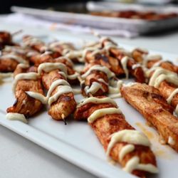 Jamestown Catering - Lemon chicken skewers plated at a stationed appetizer display by Jamestown Catering in Wilmington, Delaware.