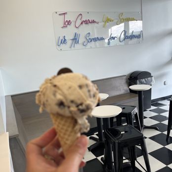 Kamm's Corners Ice Cream - a hand holding an ice cream cone - Ice Cream & Frozen Yogurt Near Me - Cleveland, Ohio Kamm's Corners Ice Cream - a hand holding an ice cream cone - Ice Cream & Frozen Yogurt Near Me - Cleveland, Ohio