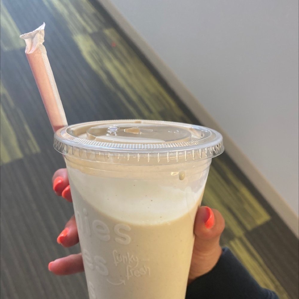 Jamba Juice - a hand holding a plastic cup with a straw - Juice Bars & Smoothies Near Me - Orem, Utah