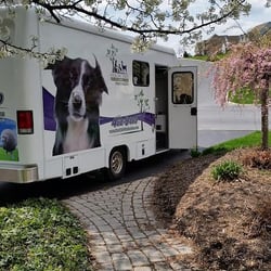 Healing Paws Veterinary Care - The mobile veterinary unit at a home on a beautiful spring day