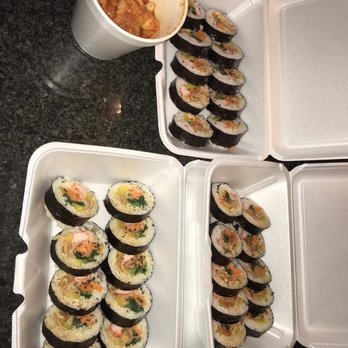 Koreana - a tray of sushi and a container of sauce - Sushi Bars Near Me - Toledo, Ohio