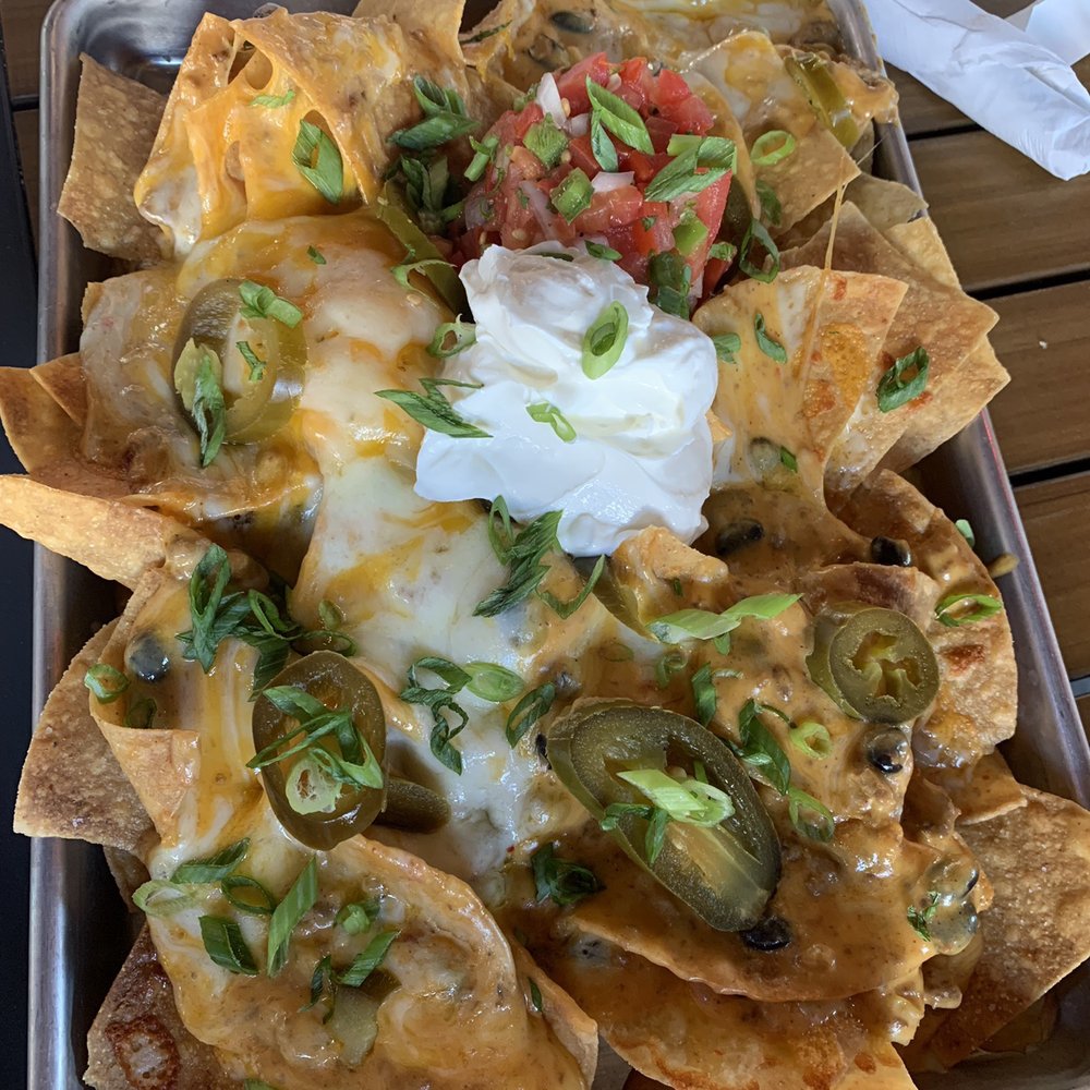 Rusty Bucket Restaurant and Tavern - The nachos appetizer! They were very good and can easily feed 4! - American Near Me - Upper Arlington, Ohio Rusty Bucket Restaurant and Tavern - The nachos appetizer! They were very good and can easily feed 4! - American Near Me - Upper Arlington, Ohio