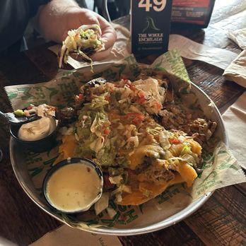 The Whole Enchilada - Pork nachos with a side of queso (not included in price, have to ask for it) - Mexican Near Me - Winter Garden, Florida The Whole Enchilada - Pork nachos with a side of queso (not included in price, have to ask for it) - Mexican Near Me - Winter Garden, Florida