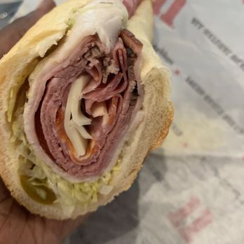Jimmy John's - a person holding a sandwich - Delis Near Me - Charlotte, North Carolina Jimmy John's - a person holding a sandwich - Delis Near Me - Charlotte, North Carolina