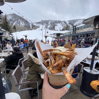 Ajax Tavern - a person holding a basket of food - New American Near Me - Aspen, Colorado Ajax Tavern - a person holding a basket of food - New American Near Me - Aspen, Colorado