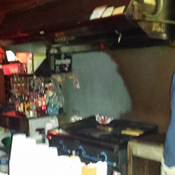 Old Pink - Grill behind the bar at Old Pink with Elvis statue. - Dive Bars Near Me - Buffalo, New York