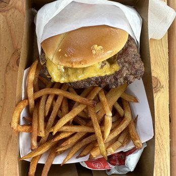 Bun N Bite - Top down of the burger and fries! Check out the ketchup packets and cardboard box. - Burgers Near Me - Antelope, California Bun N Bite - Top down of the burger and fries! Check out the ketchup packets and cardboard box. - Burgers Near Me - Antelope, California