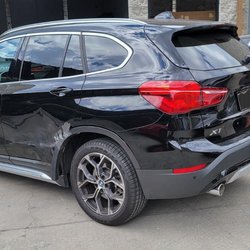 Auto Body Auto Care - Victor inspecting vehicle prior to repairs