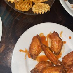 Buffalo wings and waffle fries