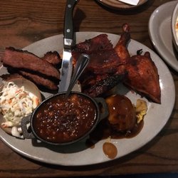 White Wolf Steakhouse - Triple Smoke Platter! BBQ brisket, ribs, and chicken. Mashed potatoes, baked beans, and coleslaw. Portions are huge!!