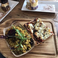 Copper Pot Artisan Bakery - Half eaten baileys dessert on top left, lime and blueberry cheesecake top right and the quinoa curry salad and veggie flatbread