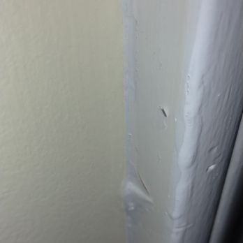 On Point Handyman Services - Runs in the trim paint and caulk separating after painting. - Handyman Near Me - Lansing, Michigan