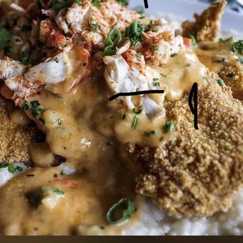 Gochas Breakfast Bar | Cascade - Cajun creole over a bed of grits topped with lump crab and Crispy Flounder garnished with parsley and green onions. - Wine Bars Near Me - Atlanta, Georgia