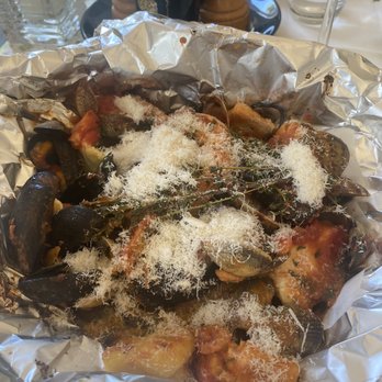 Napoli - Steamed seafood with black spaghetti (squid ink) and fresh Parmesan on top. - Italian Near Me - Haarlem, New Hampshire Napoli - Steamed seafood with black spaghetti (squid ink) and fresh Parmesan on top. - Italian Near Me - Haarlem, New Hampshire