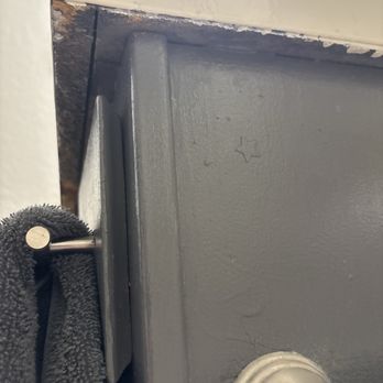 Rustic Oaks Apts - underneath one of the bathroom counters. if you're wondering what that star is, it's an acne patch (probably used) that they painted over! - Apartments Near Me - Wylie, Texas