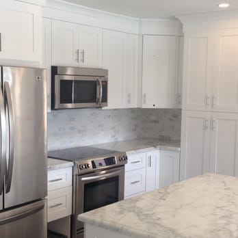 Terrastone - a kitchen with stainless steel appliances - General Contractors Near Me - Miami, Florida Terrastone - a kitchen with stainless steel appliances - General Contractors Near Me - Miami, Florida