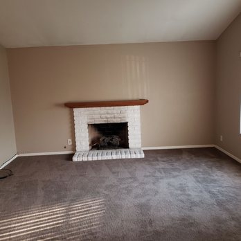 Best Carpet - a living room with a fireplace - Carpeting Near Me - Montclair, California