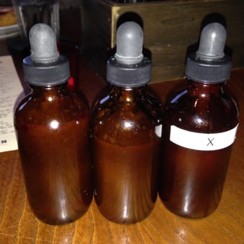 Tavern - Bottles of hot sauce - from X - XXX but only one vial is labeled - New American Near Me - Nashville, Tennessee Tavern - Bottles of hot sauce - from X - XXX but only one vial is labeled - New American Near Me - Nashville, Tennessee