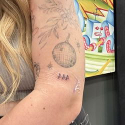 Voodoo Monkey Tattoo - Nicks line work is so crisp.   He got these tattoos tiny and fine and they looked amazing!   Tiny flower, 444 and tiny butterfly on hand!