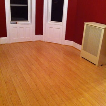 MichaelAngelo Contracting - a room with red walls and hardwood floors - General Contractors Near Me