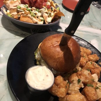Slater's 50/50 - Poke Nachos, 50/50 burger and garlic tots! Delicious! - Burgers Near Me - Denver, Colorado Slater's 50/50 - Poke Nachos, 50/50 burger and garlic tots! Delicious! - Burgers Near Me - Denver, Colorado