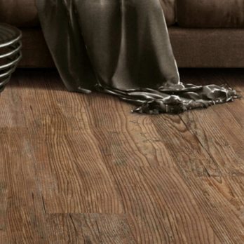 Jam Flooring - a couch with a blanket on it - Carpet Installation Near Me - Conyers, Georgia Jam Flooring - a couch with a blanket on it - Carpet Installation Near Me - Conyers, Georgia