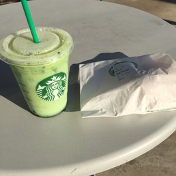 Iced green tea latte and a hidden egg, bacon, and Gouda sandwich