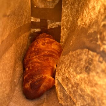 Adorable French Bakery - a croissant in a paper bag - Farmers Market Near Me Adorable French Bakery - a croissant in a paper bag - Farmers Market Near Me