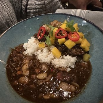 Traveler's Table - Caribbean Braised Oxtails - Cocktail Bars Near Me - Houston, Texas