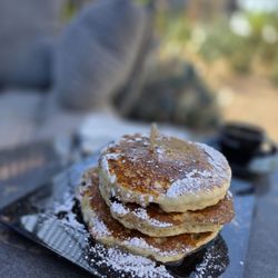 Daily Drip Coffee & Desserts - Patio shaded in morning with very comfortable seating