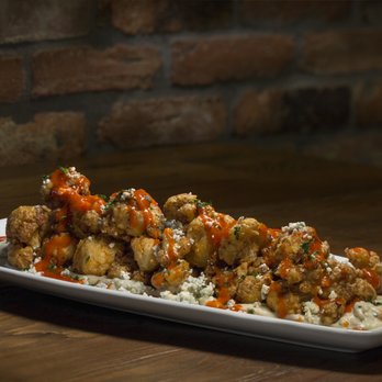 Finney's Crafthouse - Laguna Beach - a plate of fried chicken with rice and carrots - New American Near Me - Laguna Beach, California Finney's Crafthouse - Laguna Beach - a plate of fried chicken with rice and carrots - New American Near Me - Laguna Beach, California