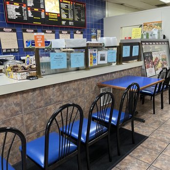 Subworks - a row of blue chairs in front of a counter - Delis Near Me - Edison, New Jersey Subworks - a row of blue chairs in front of a counter - Delis Near Me - Edison, New Jersey