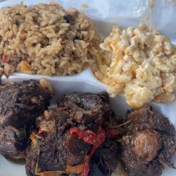 Di Real Jerk - Oxtail meal with dirty rice and Mac n cheese