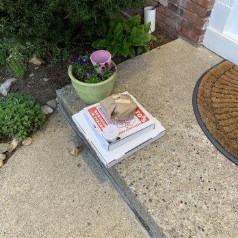 Alberto's - a stack of books on the front steps of a house - Italian Near Me - Seymour, Connecticut