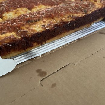 Crust Pizzeria - Detroit 1946 Pizza side view of the thickness and crusty cheese - Pizza Near Me - Havertown, Pennsylvania