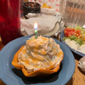 Los Amigos - a birthday cake with a lit candle - Mexican Near Me - Vail, Colorado