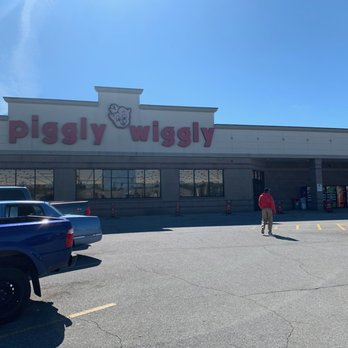 Piggly Wiggly - a person walking in front of a piggly wiggly store - Grocery Near Me - Tuscaloosa, Alabama